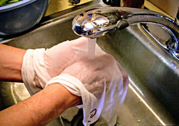 . . . then scrub each section between your hands. Finish by wringing any remaining whey out of the towels, repeating if necessary.