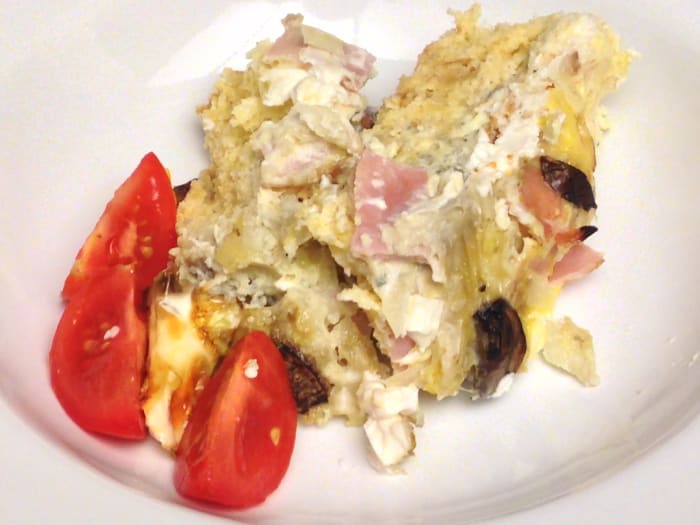 Strata made with onion rolls, gorgonzola cheese, cream cheese, mushrooms, onions, and ham