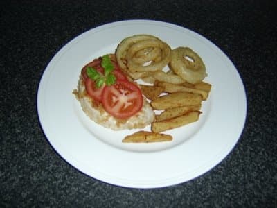 Here's one plating that I enjoy when I make these tasty, fried onions. I call this "homemade onion rings with turkey schnitzel and chips."