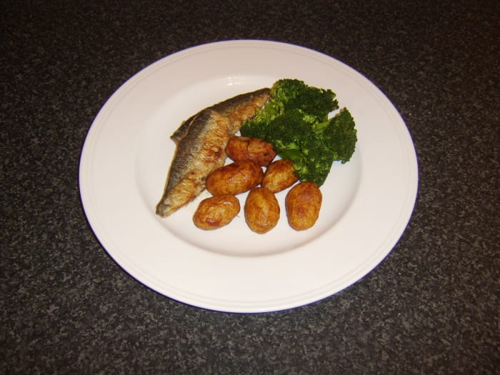 Herring loin fillets are floured and shallow fried before being served with pan roasted potatoes and broccoli
