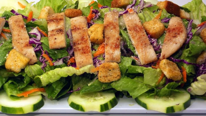 Most people prefer chicken with their Caesar salad. Add a few cucumbers and some shredded red cabbage and carrots and you've got yourself a meal.