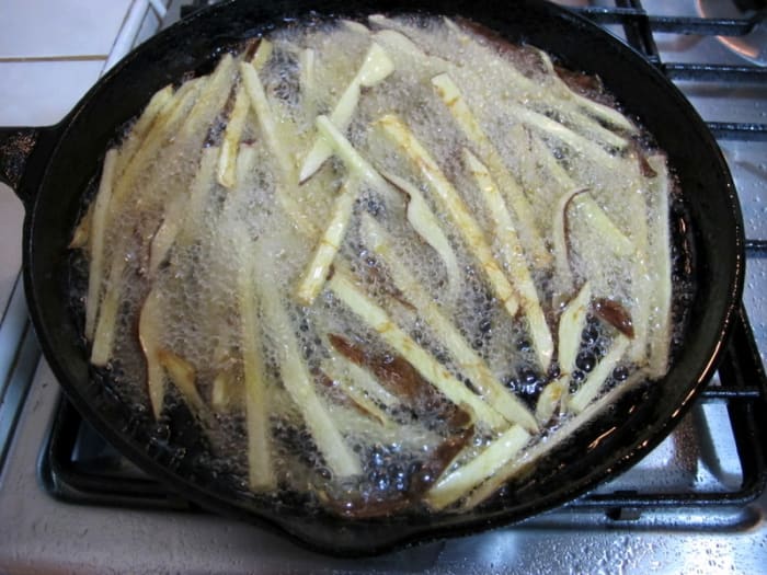 ...a cast iron skillet. Increase oil temperature to 375 Fahrenheit (190 C). Return fries to hot oil, in batches, and fry 3-4 minutes or until golden brown.