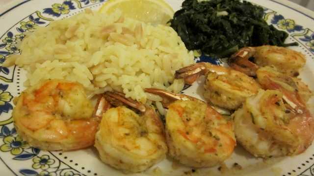 Serving suggestion includes rice pilaf and sauteed spinach with sliced garlic, olive oil, and sea salt.