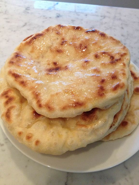 Cooking the naan in the skillet is very quick. Be sure to keep an eye on the burner so as not to burn the dough.