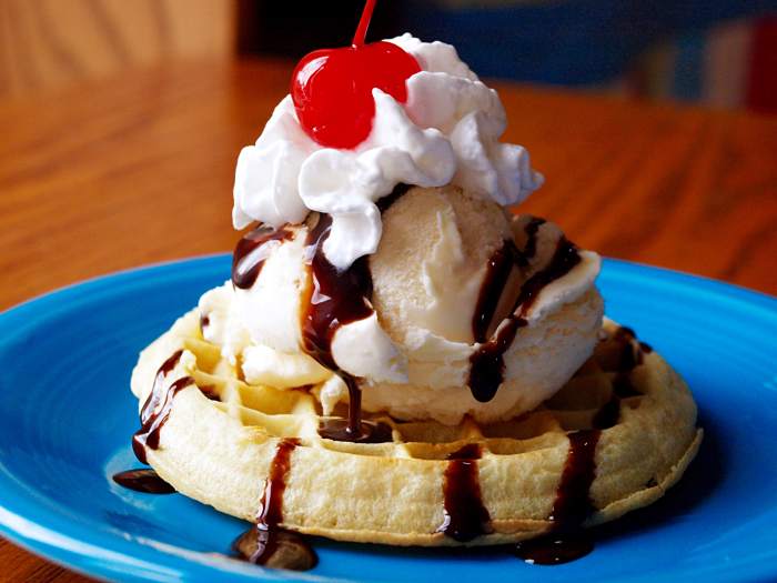 There aren't too many waffle toppings that can beat a scoop of vanilla ice cream, whipped cream and chocolate sauce.