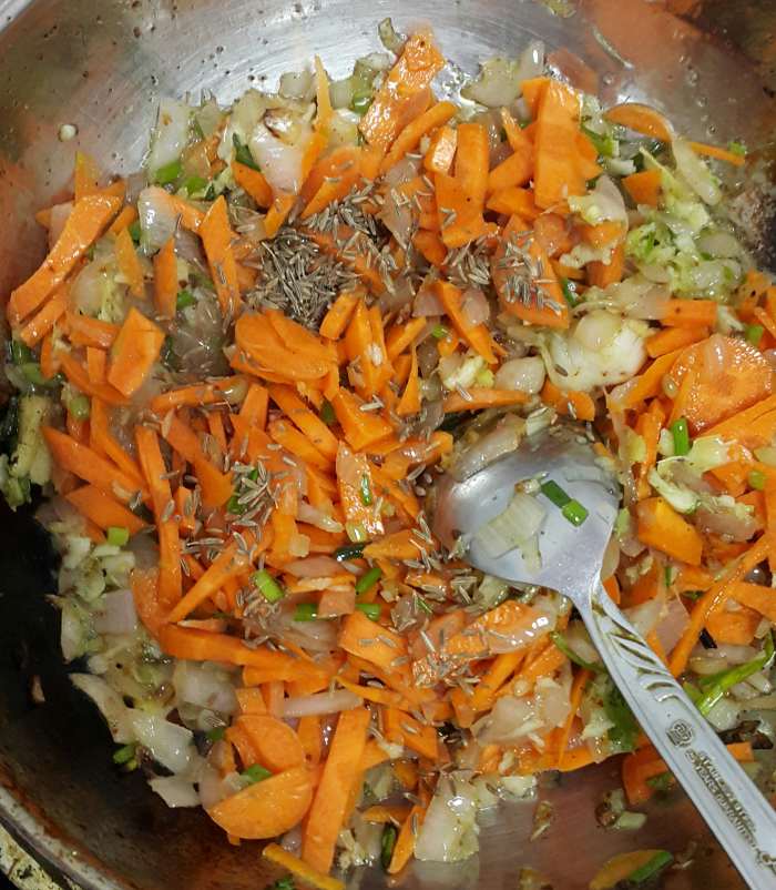 Carrots (cut into thin slices) added to the vegetable mixture. You can add whole cumin seeds at this stage if you wish to.
