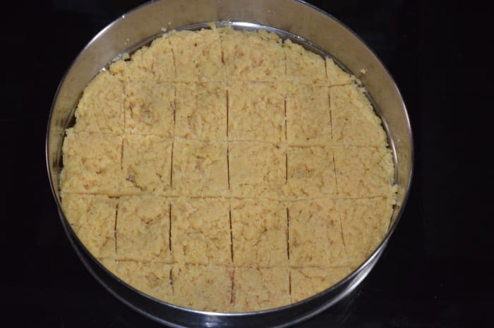 Step 12: Draw square lines on the Mysore pak. Make the lines deeper after 10 minutes. Follow the instructions.