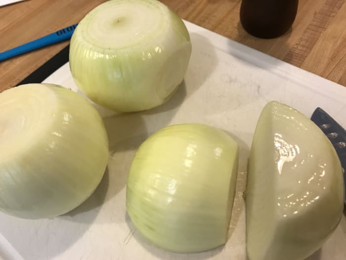 You can use any cut of onion for caramelizing, but the most traditional is slices. Cut the onions in half after peeling it to get started.