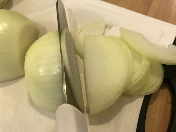 Slice each onion half into thin slices. You're increasing surface area - making more places for caramelization to occur. And caramelization brings the flavor.
