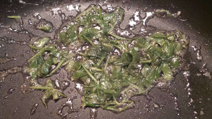 Brown butter in a skillet over medium-high heat. Add sage and rosemary, cook an additional 1-2 minutes