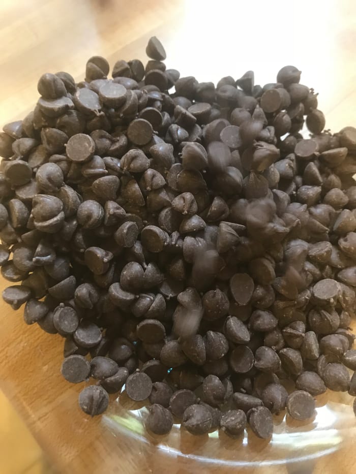 Place dark chocolate into a glass bowl. Be sure to use good-quality dark chocolate chips or high-quality baking bars and chop them finely before adding them to the bowl.
