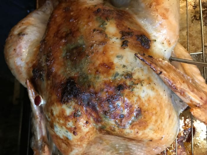 Baste the bird about every half hour with the remaining herb butter. This picture shows what it looks like after an hour of roasting. If the bird looks like it's getting too dark, just tent it loosely with a little foil.
