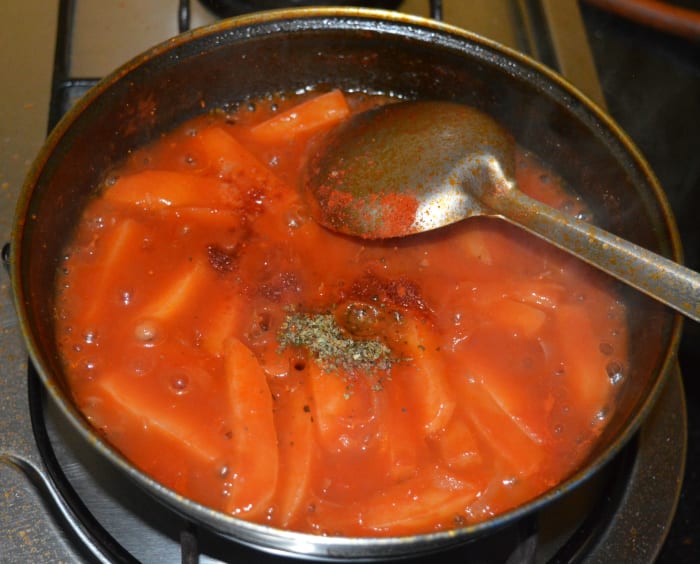 Step six: Add Italian pasta spices, chili powder, sugar, and remaining salt. Simmer the mixture for a minute. Add water to adjust the consistency. This soup should be thin in consistency.