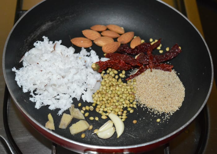 Step 1: Take all the ingredients as per instructions in a pan. Fry them until they become a bit roasted.