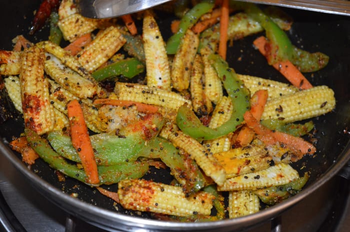 Cover the pan and cook until the veggies become soft and half cooked. This step will take about 6 minutes.