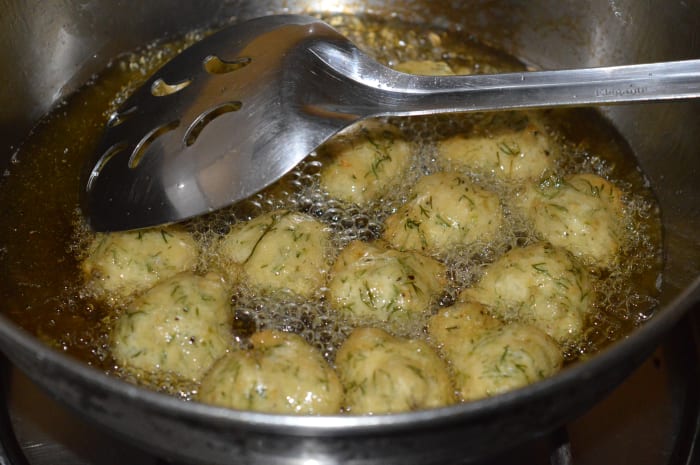 Turn them occasionally to ensure uniform frying. Fry until the fritters are golden brown and crunchy. Remove them onto an absorbent paper towel.