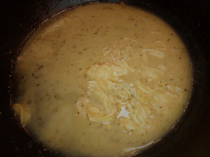 After the chicken and potatoes are roasted, the whole cloves of garlic are soft and creamy. Mash them into the pan juices to create a rich sauce.