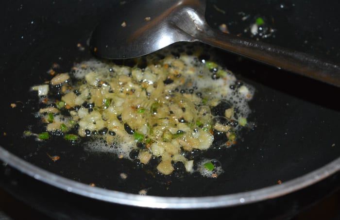 Step one: Cook barley as per instructions. Set aside. In a heated deep-bottomed pan, saute chopped garlic, ginger, and green chilies with butter until you get a nice aroma.