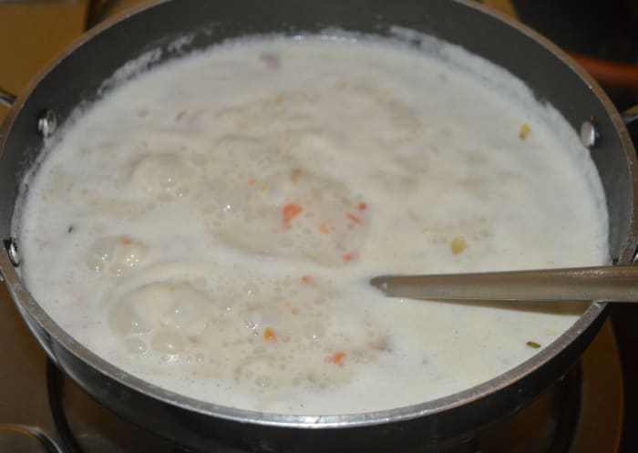 Allow the mixture to boil for 5 minutes. Check for consistency and taste. Add salt if needed. Add water to adjust consistency. Mix well. Turn off heat.