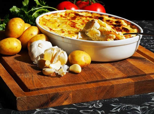 A creamy scalloped potatoe casserole with potatoes, milk, cheese and other flavorful ingredients.