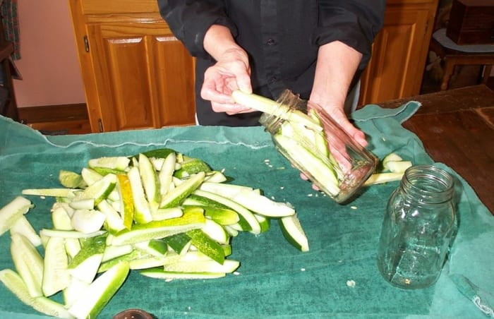 If you have a great many pickles to pack, or lack a roasting pan, laying them out on a bath towel may be helpful.