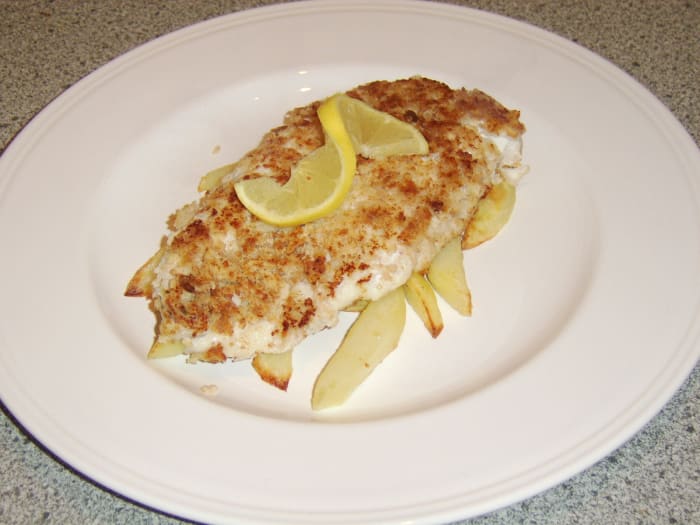 A Scottish fish supper features battered haddock and chips. This is a healthier version of the meal that uses breadcrumbs.