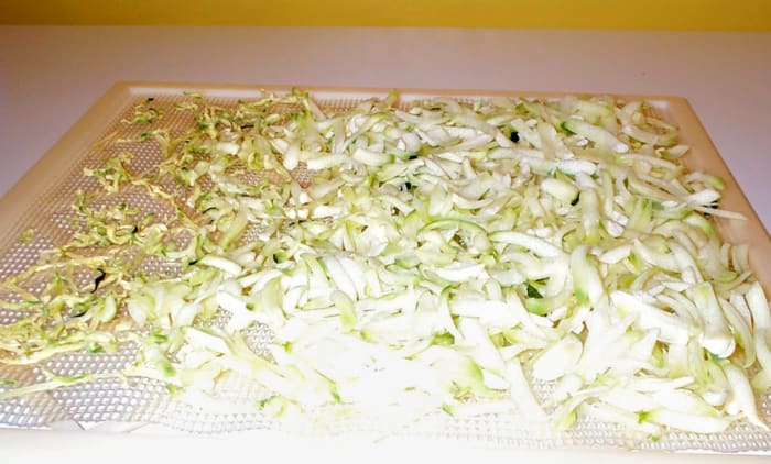 In some dehydrators, you will need to turn your trays around halfway through the process. As you can see, the shreds on one side is shrinking nicely, but on the other are hardly started.