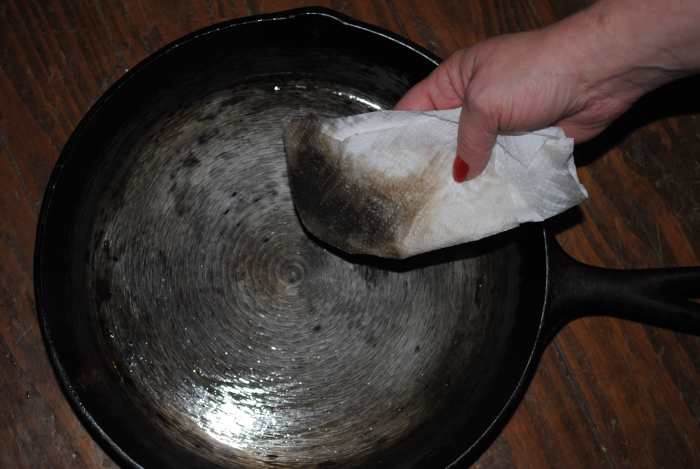 A super-clean, just-scrubbed skillet still releases a LOT of gunk. Keep wiping down with fresh oil and clean paper towels, and you'll get it REALLY clean.