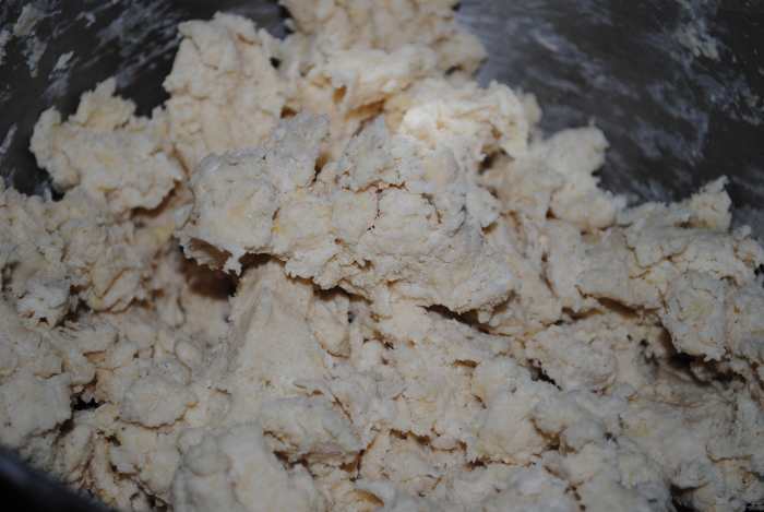Once the egg and buttermilk are added - the dough will begin to come together. If you're using a mixer, stop when it looks like this. Here is where you begin to knead.