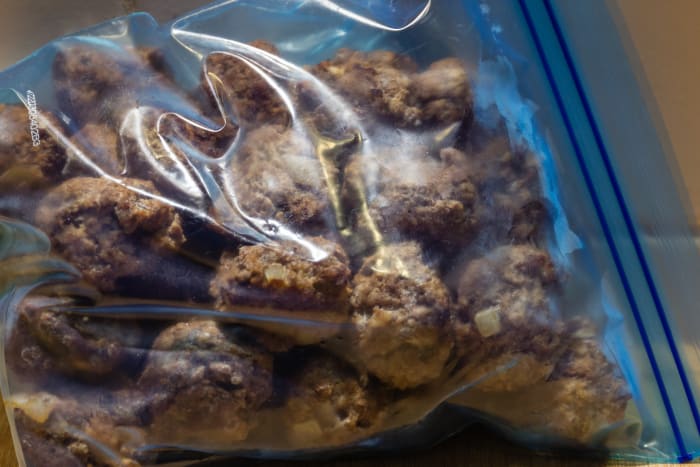 First freeze the meatballs in a single layer so that they don't stick together. Then you can place them all in a bag for storage.