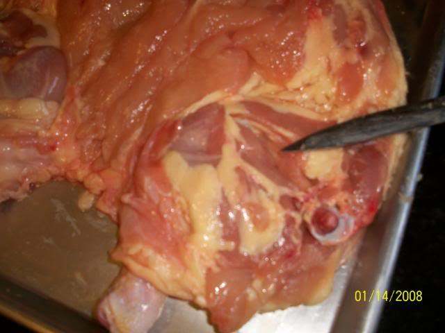 Removing the thigh bone takes some patience, but it will ensure you'll be able to slice through easily when the turducken is done.