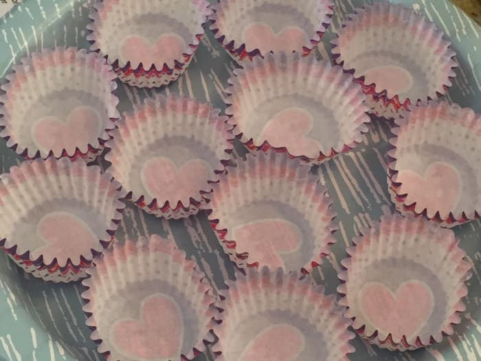 Use paper mini-muffin cups in a container or plate for making candies.