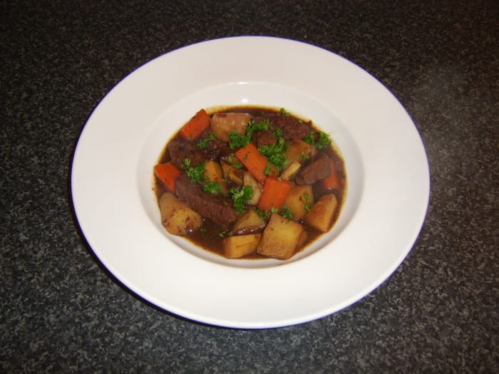 Topside of beef slow cooked in beef stock and brown ale before mixed root vegetables are added for the final stages of cooking