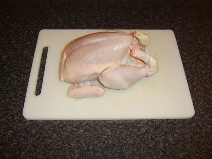 The leg portions, wings, and breast fillets were removed from this chicken to serve a variety of purposes, and the carcass's remainders were used to make the broth.