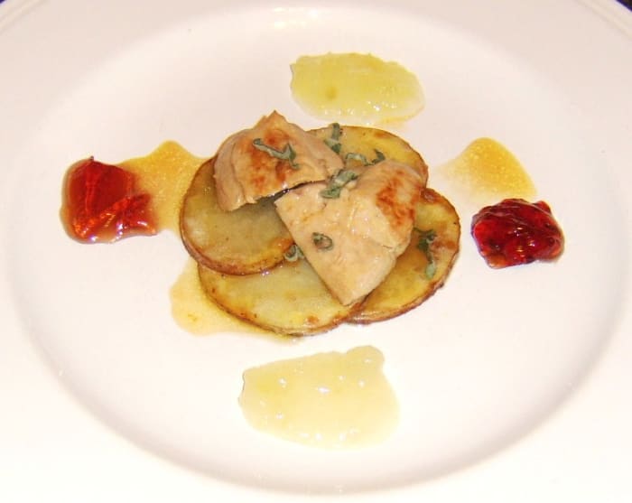 Partridge breast pan fried in herb butter and served on potato discs with cider sauce, applesauce and redcurrant jelly