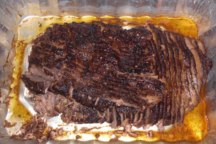 This is the finished sliced brisket. It tastes and looks like it was smoked in an outdoor BBQ smoker but was actually done in my oven! It was a hit at my brother-in-law's Super Bowl Party!