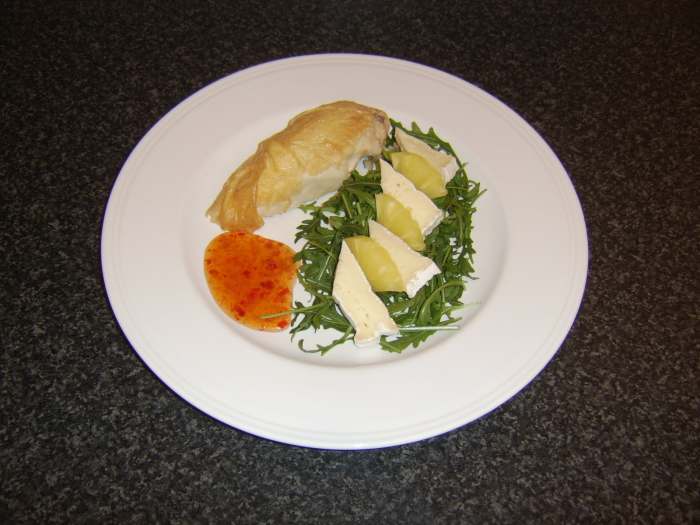 Leftover piece of roast chicken is served with a simple cheese and pineapple salad and sweet chilli sauce