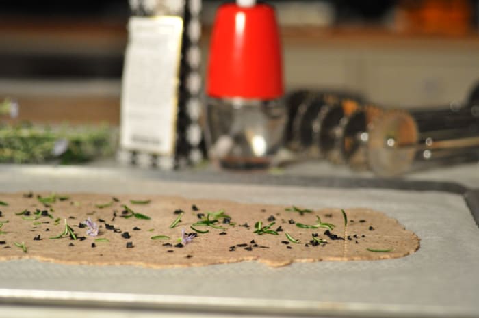 Black Lava Sea Salt and Rosemary scattered over the chilled levain cracker dough just before baking. Image: © Siu Ling Hui