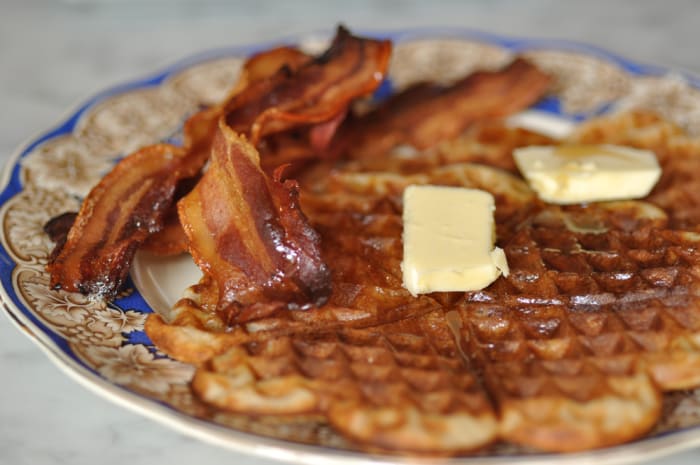 Sourdough waffles with crisp dry-cured bacon, maple syrup (and of course, butter). Image: © Siu Ling Hui