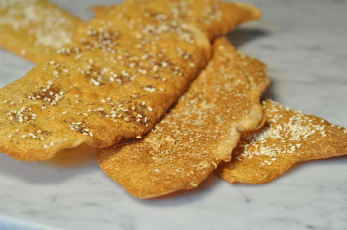 3 different flavours of Levain Crackers. Toppings are Za'atar (top), finely grated Grana Padano (middle), and Sesame Seeds (bottom).