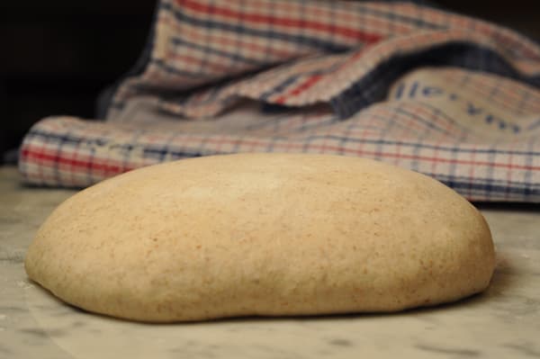 After bulk fermentation, dough is turned out of bowl and shaped. Then covered with a light dusting of flour and a tea towel and left to undergo "bench rest". For this batch, I let bench rest go for about 1 1/2 hours as the kitchen was quite cool. Ima