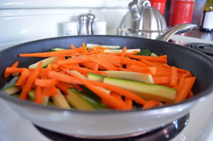 Tenderize your match-stick cut veggies for a few minutes after spraying with cooking spray or use a dab of olive oil.