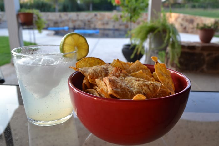 The perfect antidote to a stressful day: a Margarita on the rocks and your own personal bowl of Julio's Chips. (Tell the kids to get their own bowl).