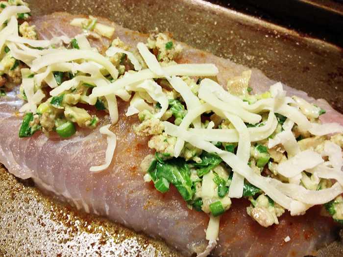 -- All Rights Reserved -- Do Not Distribute -- Spinach, Cream Cheese, Mozzarella Cheese, Scallions, Milk Wet Mixture Spread on Basa Fish Fillet, Sprinkled with Mozzarella Cheese