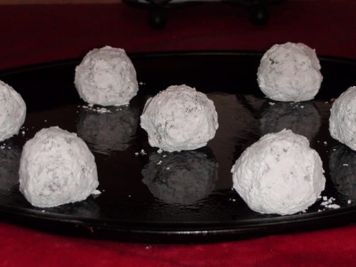 7. Make sure to get plenty of powdered sugar on the golf-ball-sized balls. Leave them plenty of room on the cookie sheet to spread.