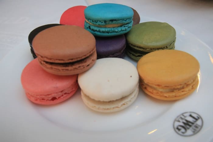 These popular bake shop treats are really two meringue cookies made with ground nuts and put together with frosting in the middle.