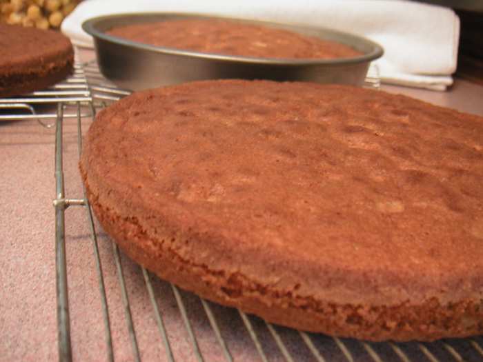 Taking the cakes out of the pan can be daunting. There is a simple way to do this using waxed paper and a plate.