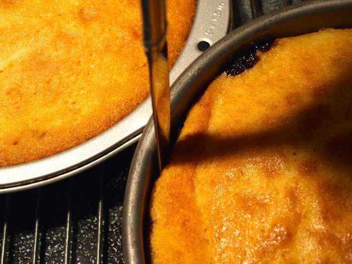 Bake the cake for 45 to 50 minutes or until a toothpick comes out cleanly. Immediately run a knife around the edge and turn over pan onto a serving platter.