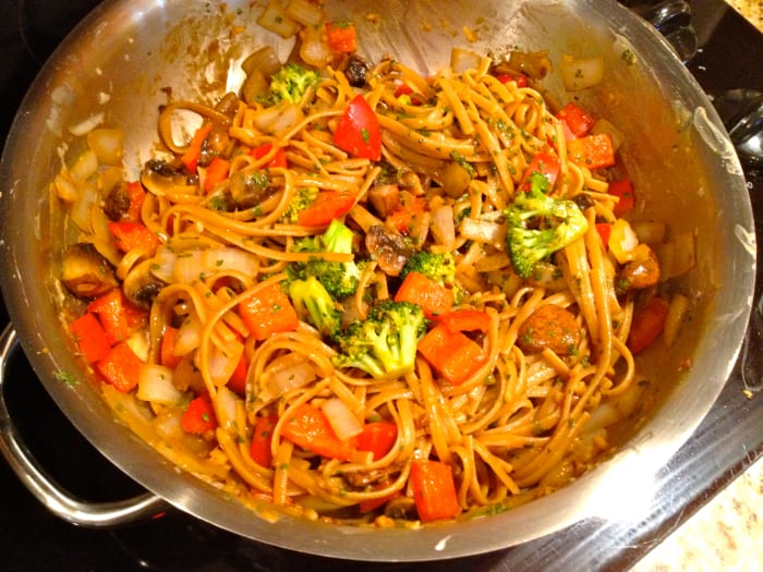 Add pasta and cook for 1 to 2 minutes or until thoroughly heated, stirring well. Top with optional cilantro and peanuts.