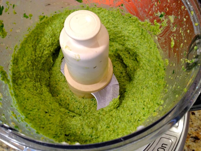 Process ingredients until smooth, adding liquid from garbanzo bean can a little at a time as needed until the hummus is at a desired consistency.